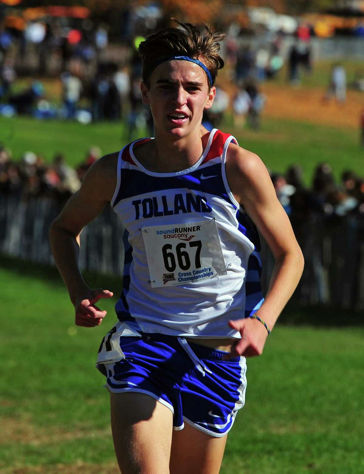 Tolland's Alec Sauter crosses the finish line during Class M cross country championship action in Manchester, Conn., on Saturday Oct. 26, 2019.