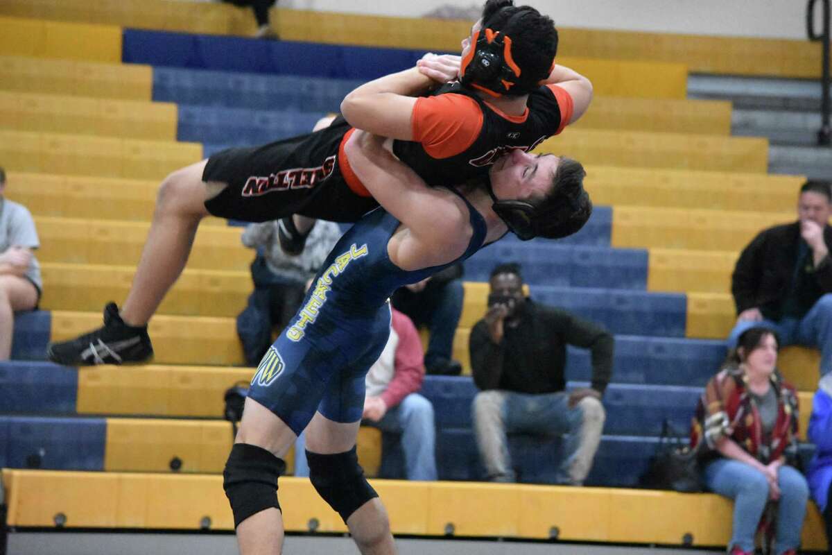 East Haven’s Tanner DiVito slams Shelton’s Christian Olavarria to the mat at East Haven High on Tuesday, Jan. 12, 2020. (Pete Paguaga, Hearst Connecticut Media)
