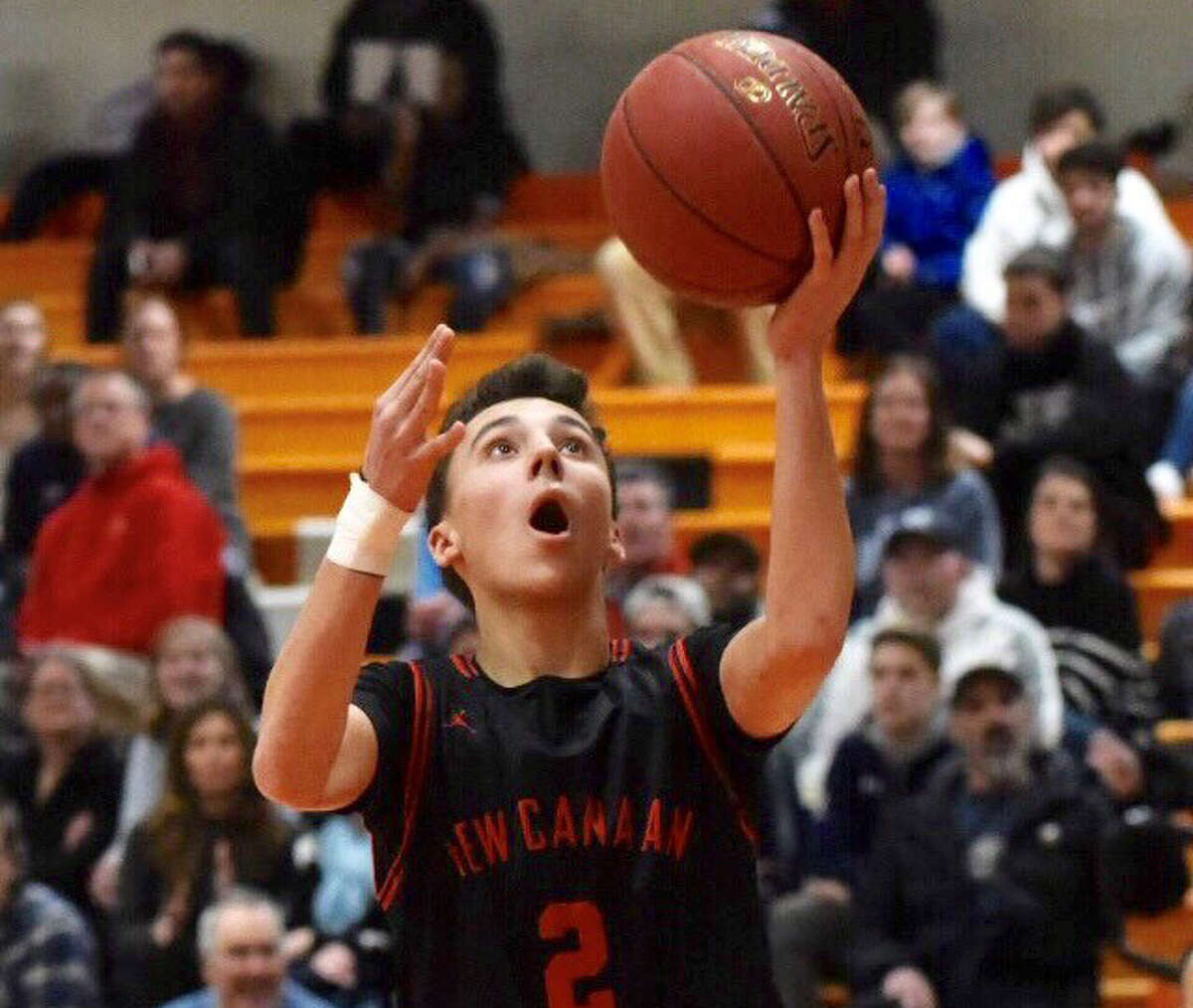 New Canaan’s Aaron Fishman (2) goes up for two points during the Rams’ boys basketball game against Stamford at Stamford High School on Friday, Jan. 17, 2020.