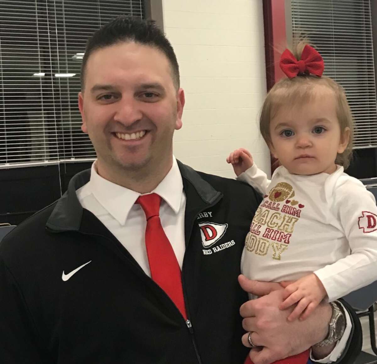 Derby’s Steve Bainer (with his daughter, Gabriella) will be both the school’s head baseball and football coach. (Photo via Steve Bainer)