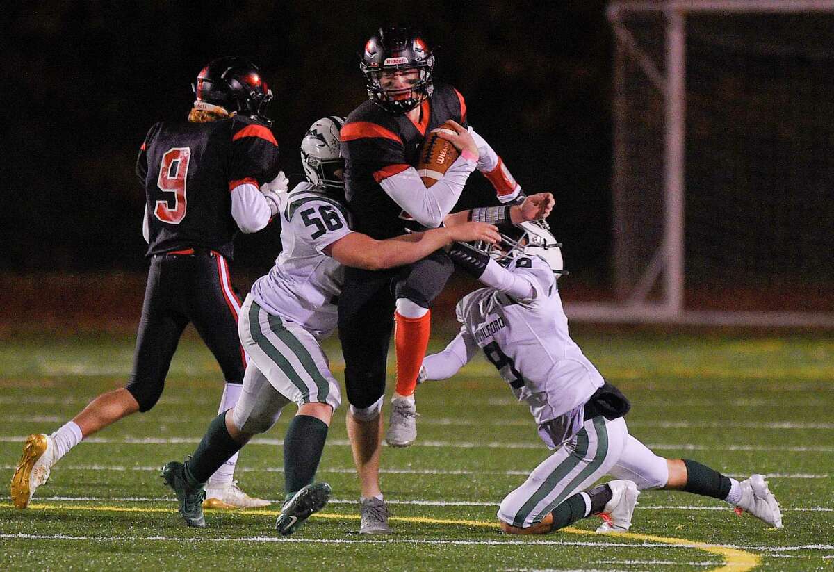 Fairfield Warde's Joey Gulbin (4) breaks away from New Milford during an alliance football game at Fairfield Warde High School in Fairfield, Conn. on Oct. 25, 2019. Warde defeated New Milford 34-21.