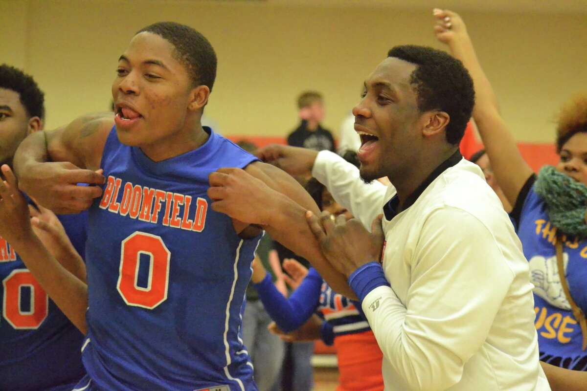 Bloomfield’s Tyrique Jones (0) celebrates after the Warhawks 72-41 win over Terryville.