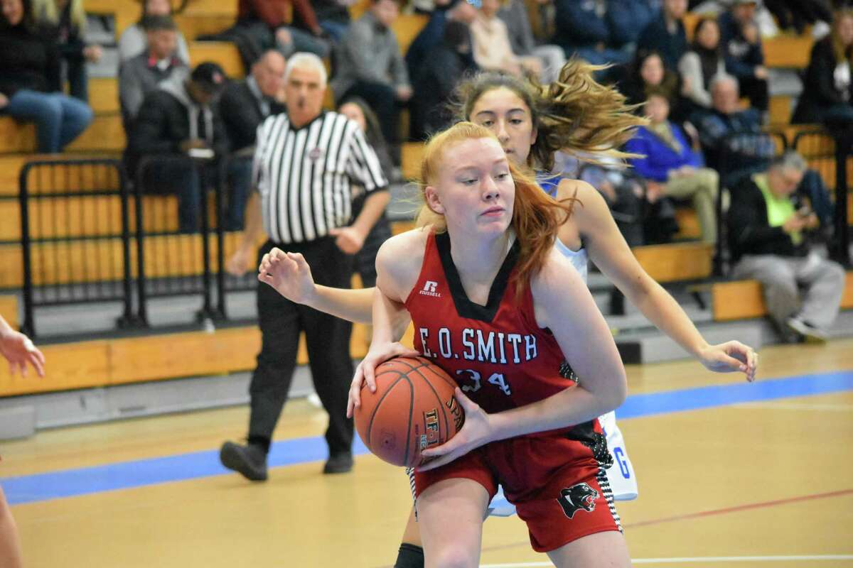 E.O. Smith’s Madison Hughes grabs a rebound during the CCC tournament quarterfinals at Glastonbury high school on Saturday, Feb. 22, 2020. (Pete Paguaga, Hearst Connecticut Media)