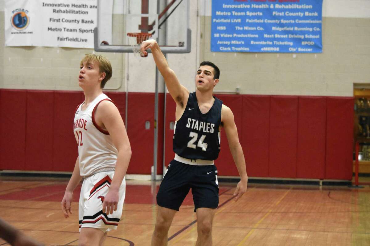 Staples’ Jake Thaw hits a three-pointer during the FCIAC quarterfinals at Fairfield Warde on Saturday, Feb. 29, 2020. (Pete Paguaga, Hearst Connecticut Medai)