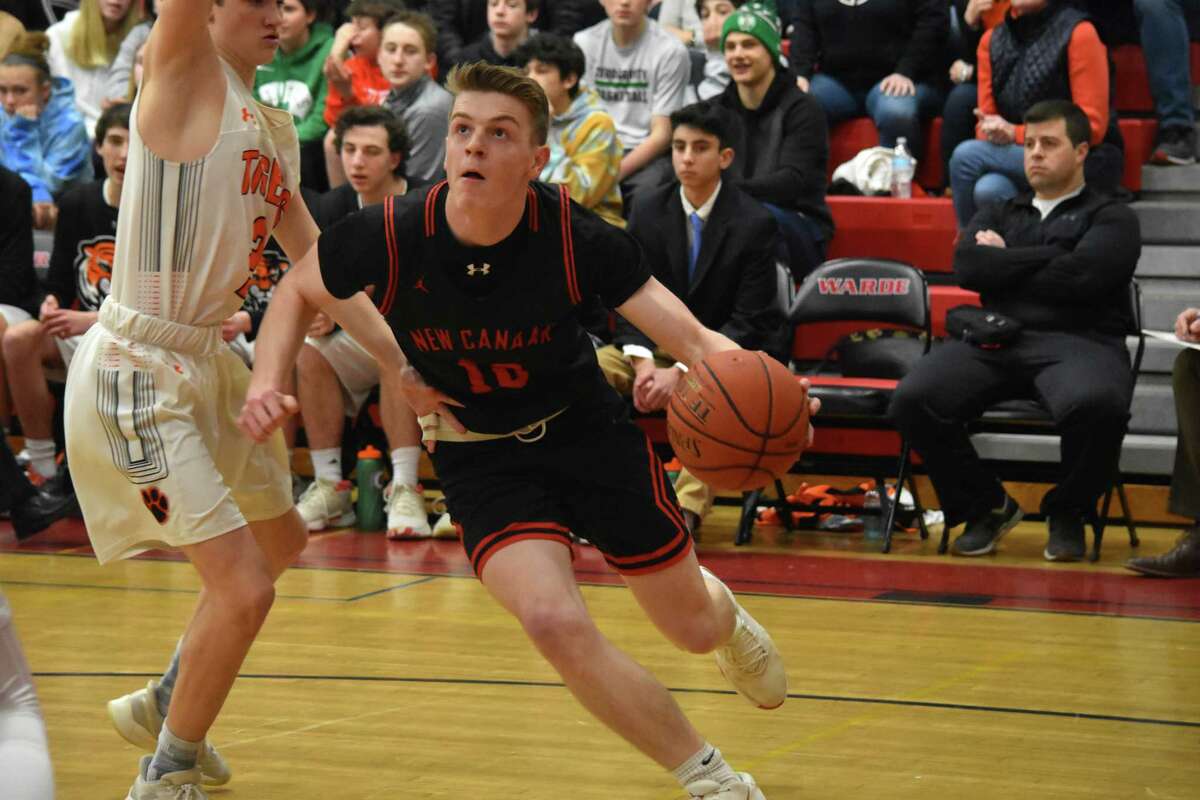 New Canaan’s Ryan McAleer drives to the basket during the FCIAC quarterfinals at Fairfield Warde on Saturday, Feb. 29, 2020. (Pete Paguaga, Hearst Connecticut Medai)