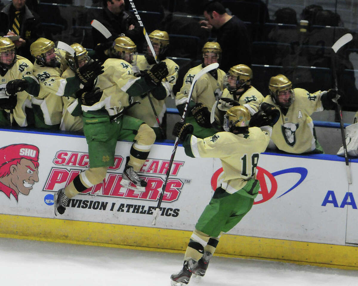Notre Dame’s hockey team celebrates Ryan Lynch’s go-ahead goal in the third period of the Division I quarterfinals vs. New Canaan at Webster Bank Arena (Photo Peter Hvizdak)