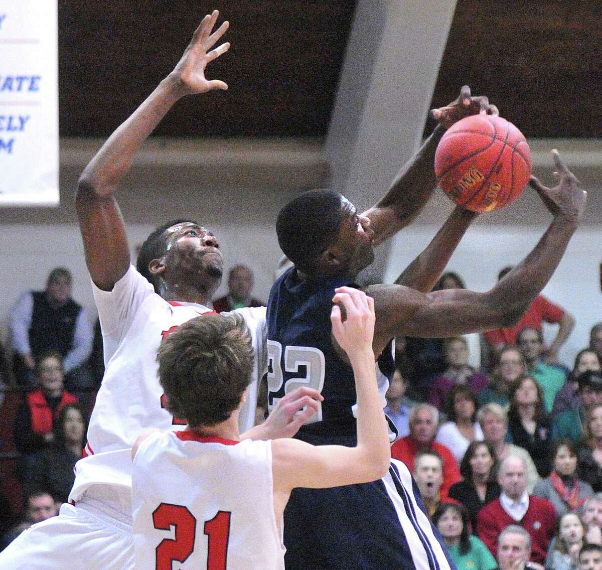 Fairfield Prep’s Paschal Chukwu battles for a rebound with Hillhouse’s Shane Christie during the fourth quarter during the Class LL boys basketball quarterfinals. (Peter Casolino-New Haven Register)