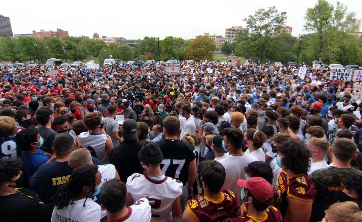 Over a thousand high football coaches, players and their families attend a rally held on the grounds of the State Capitol building in Hartford, Conn., on Wednesday Sept. 9, 2020. They came to Hartford to protest not being able to play in the upcoming season due to the coronavirus.