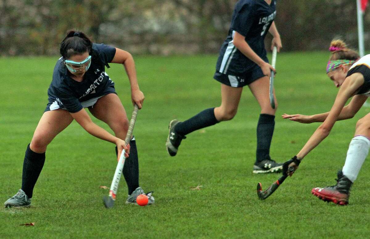 Lauralton Hall's Gulia Emanuel, left, hits a shot to score against Amity during SCC Field Hockey Division B final action in Woodbridge, Conn., on Wednesday Nov. 11, 2020. Defending at right is Amity's MaCaelan Rahn.
