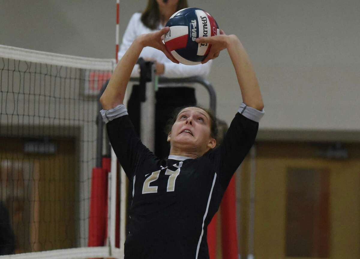 Trumbull's Ali Castro (27) sets the ball during a girls volleyball match in New Canaan on Thursday, Oct. 3, 2019.