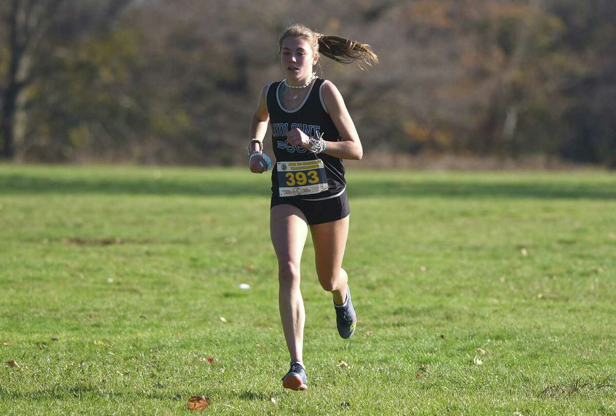 Ludlowe's Anna Keeley (393) runs to a first-place finish in the FCIAC East girls cross country race in New Canaan's Waveny Park on Wednesday, Nov. 4, 2020.