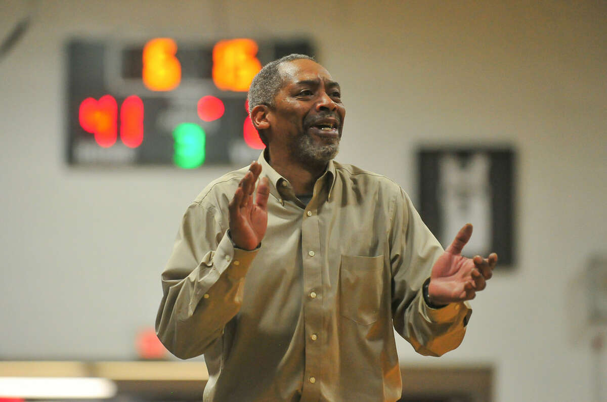 Hearst CT Media file photo Head Coach Bernie Lofton of the Bassick Lions applauds his teams play during a Division 1 second round game against the East Hartford Hornets at Bassick High School on Friday March 9, 2018 in Bridgeport, Connecticut. 