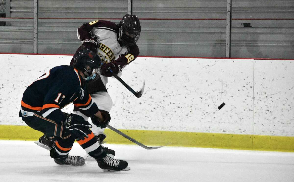 Action between Sheehan and Lyman Hall in a hockey game at the Northford Ice Pavilion on Saturday, Feb. 27, 2021. (Pete Paguaga, Hearst Connecticut Media)