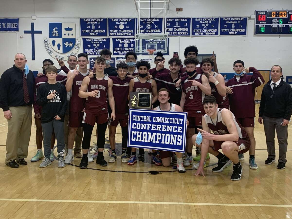 Bristol Central celebrates its 2021 CCC Championship after a 69-68 OT victory over defending champion East Catholic (Photo Sean Patrick Bowley / Hearst Connecticut Media)