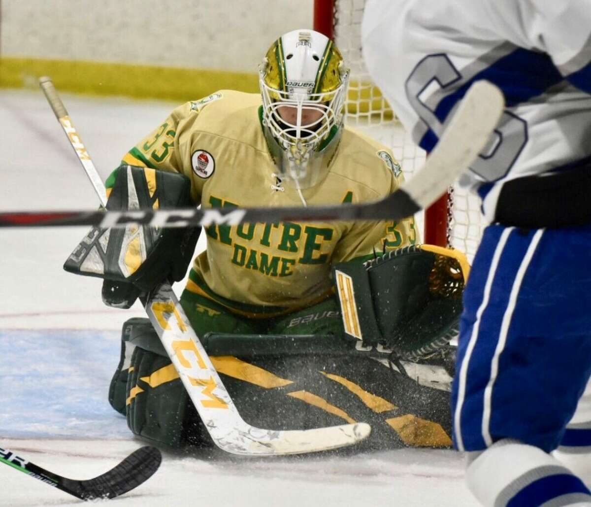 Notre Dame-West Haven goalie Connor Smith makes a save against Darien during a boys ice hockey game at the Darien Ice House on Monday, Feb. 15, 2021.