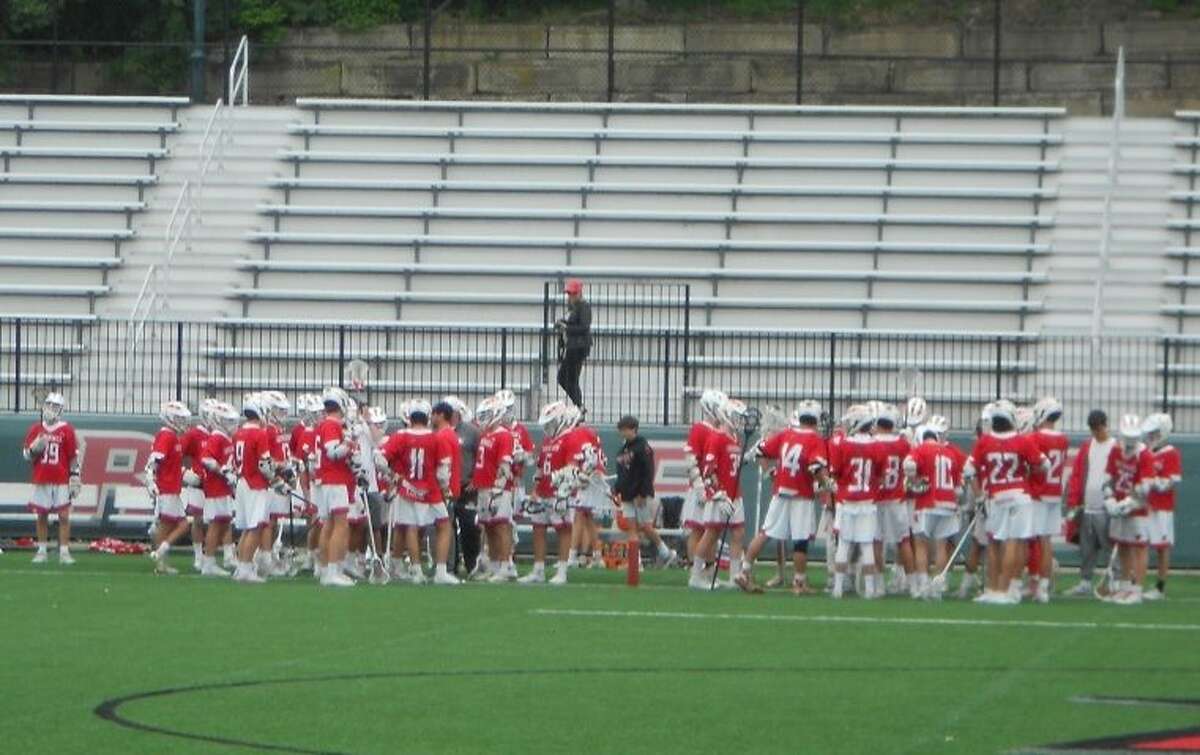 Greenwich huddles at a time out during its 16-3 loss to Fairfield Prep in the CIAC Class L boys lacrosse playoffs, May 30, 2019, at Rafferty Stadium in Fairfield, Conn.