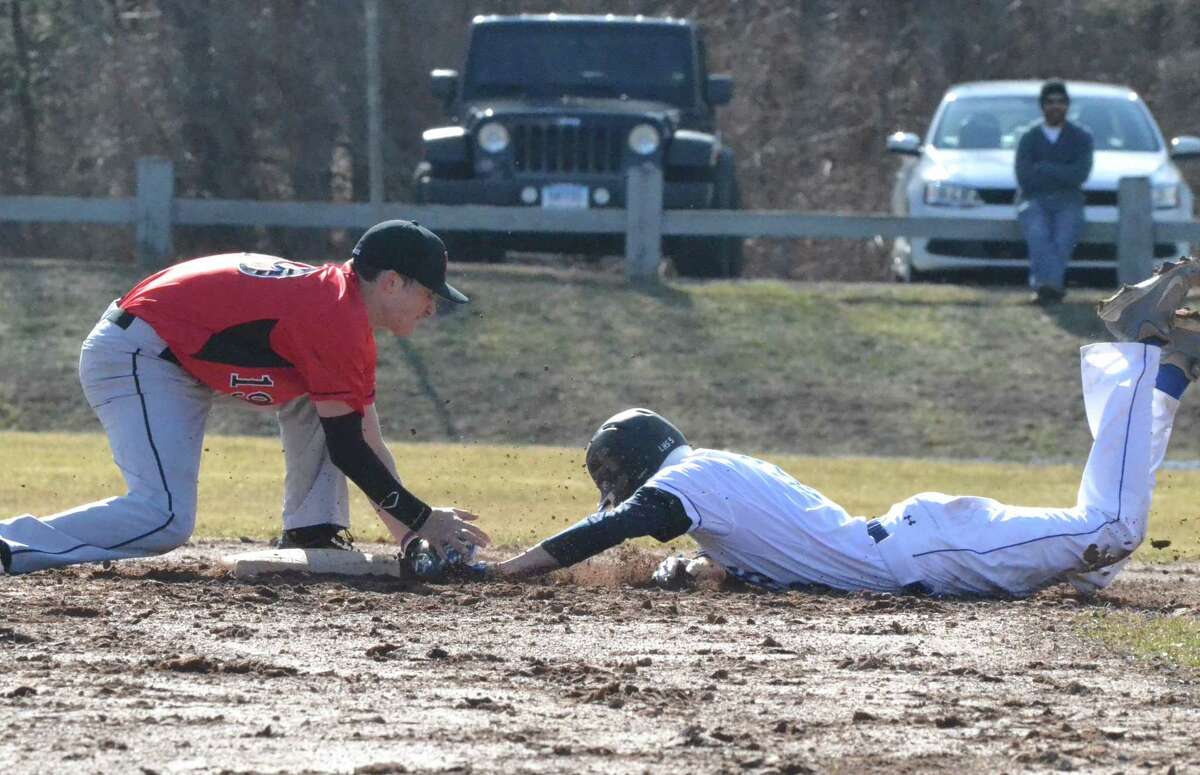 Northwestern’s Tony Pucino tags out Litchfield’s Nick Ganio while trying to steal second base.