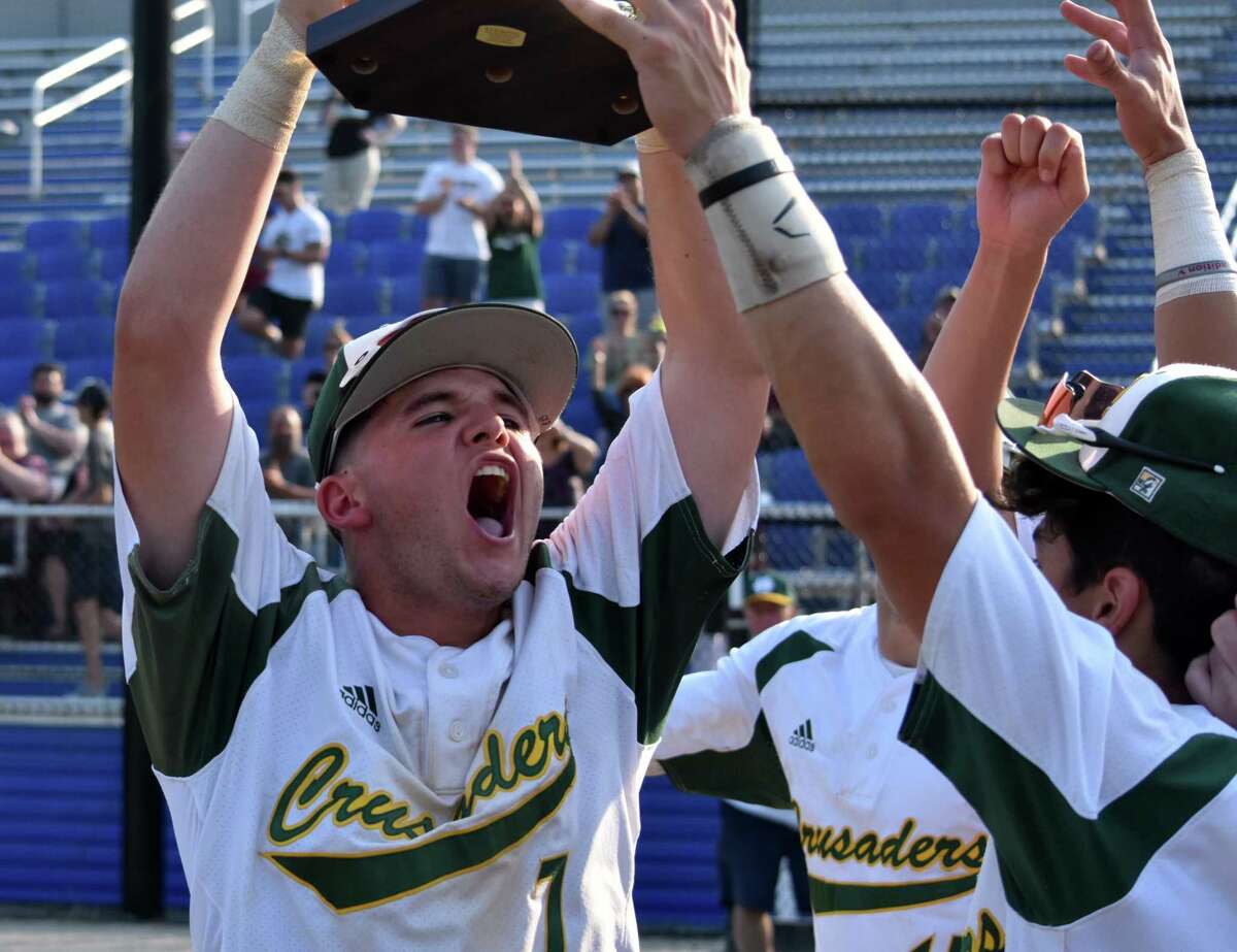 Holy Cross' Logan Bessette lifts the NVL baseball championship trophy after Holy Cross' 3-2 win over Watertown at Municipal Stadium, Waterbury on Wednesday, May 26, 2021. (Pete Paguaga/Hearst Connecticut Media)