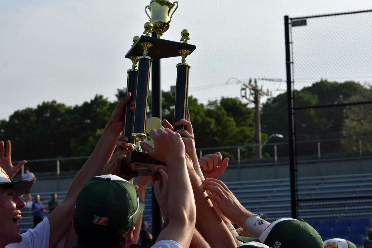Holy Cross celebrates its NVL baseball title after a 3-2 win over Watertown at Municipal Stadium, Waterbury on Wednesday, May 26, 2021. (Pete Paguaga/Hearst Connecticut Media)