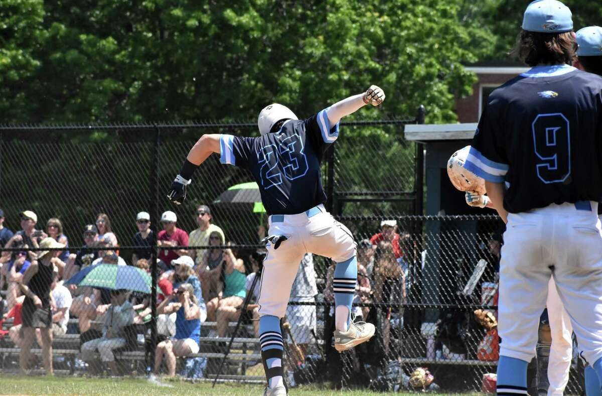 East Catholic's Trevor Juan slams on home plate after hitting a home run during the Class M baseball quarterfinals between East Catholic and Weston at Penders Field at East Catholic high school, Manchester on Saturday, June 5, 2021. (Pete Paguaga, Hearst Connecticut Media)