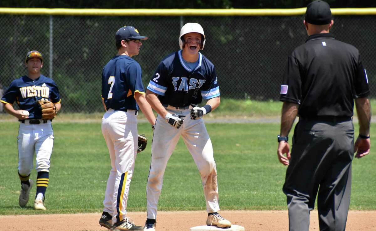 East Catholic's Hank Penders celebrates after reaching second base during the Class M baseball quarterfinals between East Catholic and Weston at Penders Field at East Catholic high school, Manchester on Saturday, June 5, 2021. (Pete Paguaga, Hearst Connecticut Media)