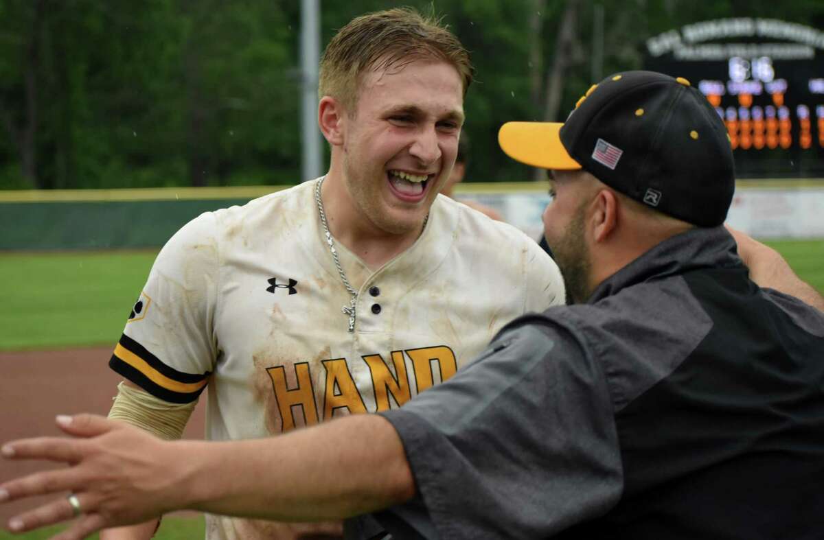 Hand celebrates beating Avon, 2-1, in 10 innings during the Class L baseball semifinals at Palmer Field, Middletown on Tuesday, June 8, 2021. (Pete Paguaga, Hearst Connecticut Media)