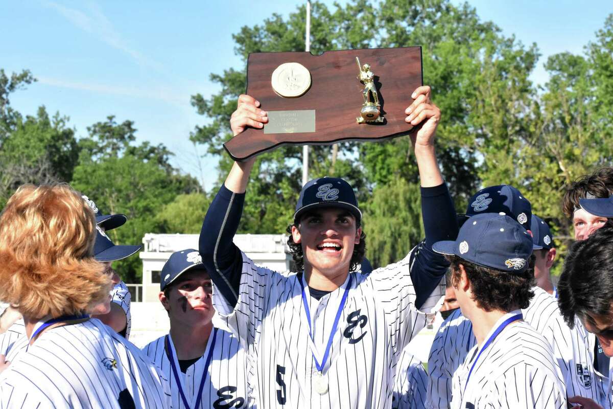 East Catholic's Frank Mozzicato lifts the plaque after winning the CIAC Class M baseball championship against Northwestern, 7-0, at Palmer Field, Middletown on Saturday, June 12, 2021. (Pete Paguaga, Hearst Connecticut Media)