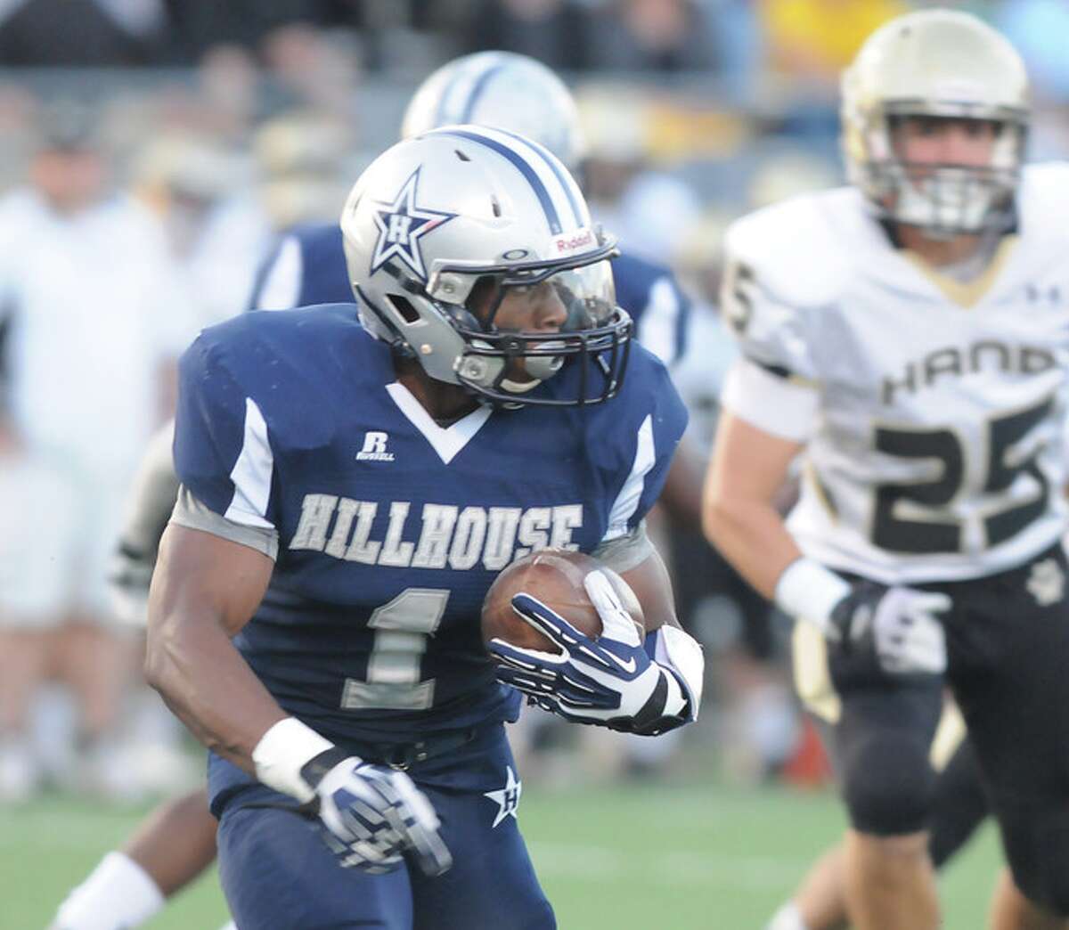 Hillhouse’s Harold Cooper looks for room to run in the Academic’s loss to Hand Sept. 20, 2013. Mara Lavitt, Register. Cooper went over 5,000 yards for his career in the game.