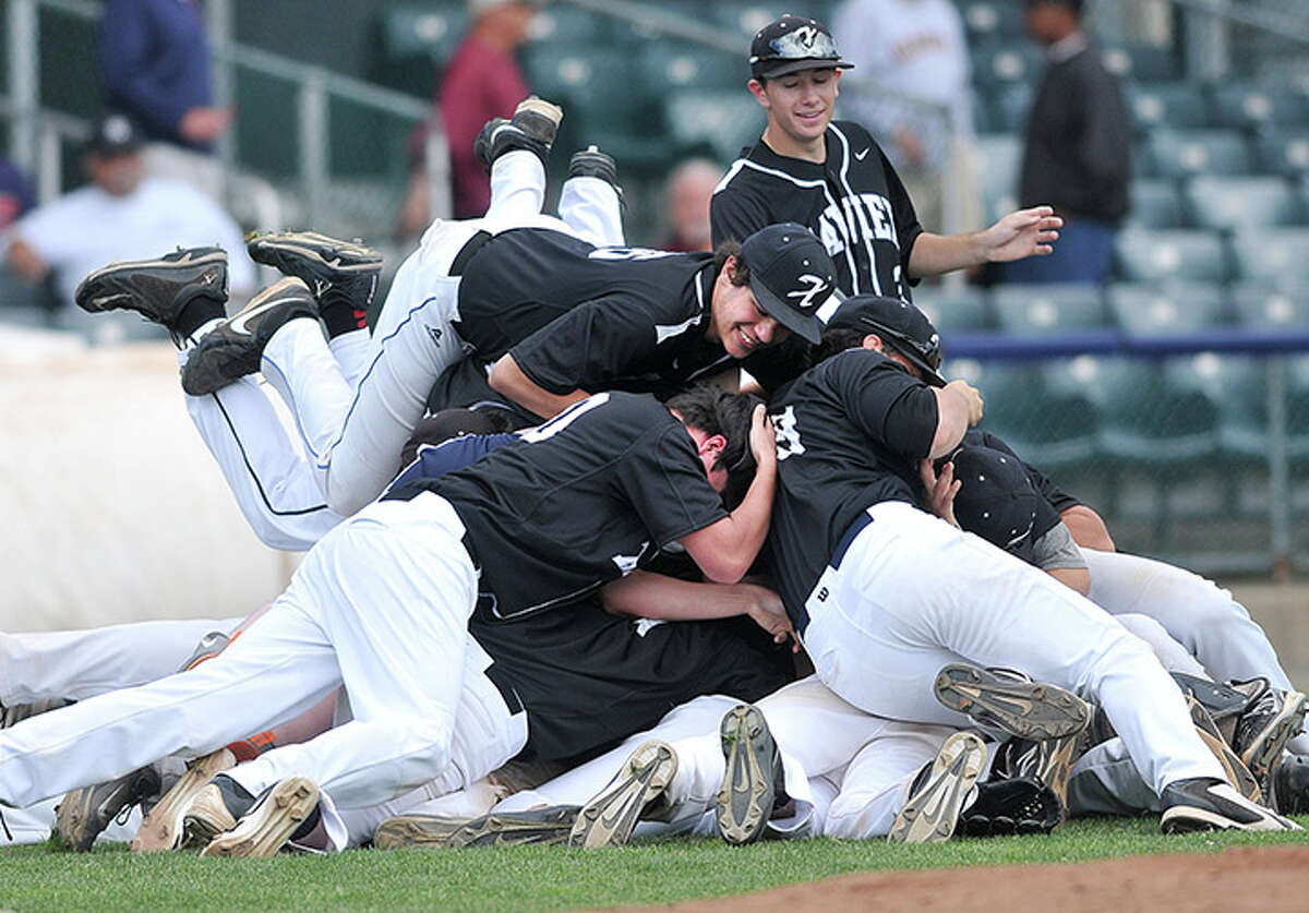 Xavier celebrates as they beat Amity Regional for the SCC Championship at Yale Field. (Peter Casolino-New Haven Register)