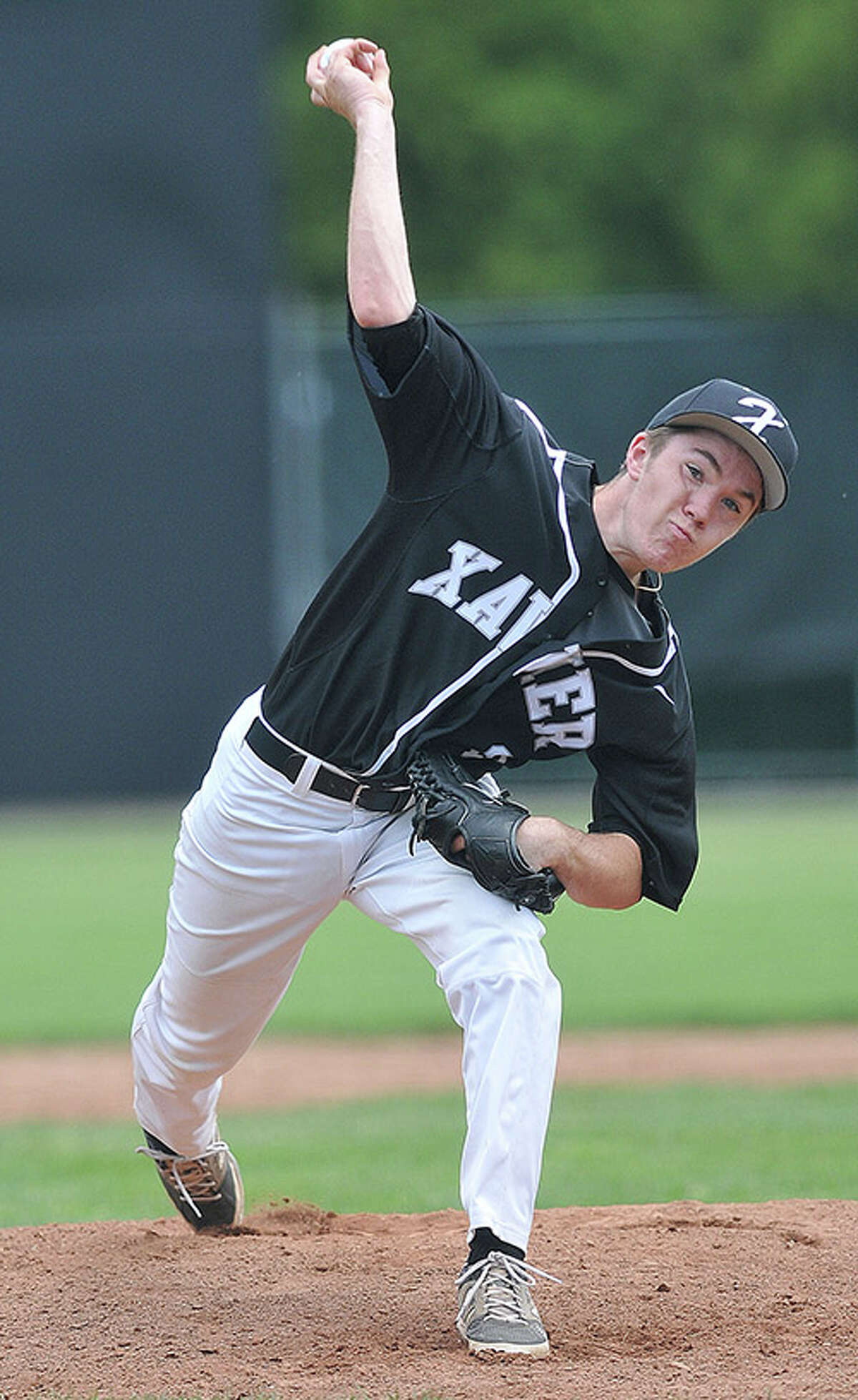 Xavier’s Kyle Wollman delivers in the 6th inning against Amity Regional during the SCC Championship at Yale Field. (Peter Casolino-New Haven Register)