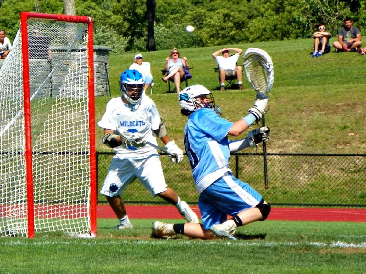 East Catholic goalie Brendan Casey deflects a shot in the second half vs. Old Lyme in the Class S quarterfinals. The Eagles defeated the Wildcats, 6-5 to advance to the semi-finals vs. Brookfield on Wednesday. Derek Turner — GameTimeCT
