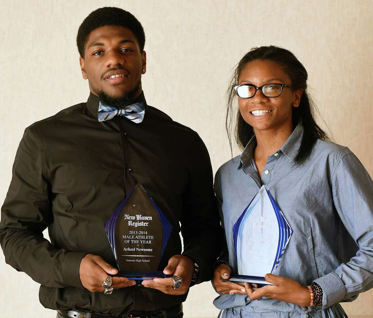New Haven Register Male and Female Athlete Of The Year winners, Arkeel Newsome (Ansonia High School) and Danae Rivers (Wilbur Cross High School) pose with their trophies after the awards ceremony at Amarante’s Sea Cliff in New Haven. June 25, 2014. (Peter Casolino-New Haven Register)