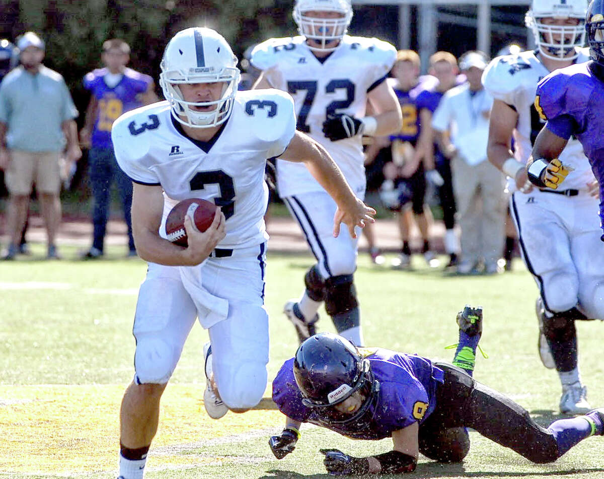 Staples’ Teddy Coogan runs with the ball during a game last year. He’ll take over at quarterback for graduated four-year starter Jack Massie. (Photo by Mary Albl)