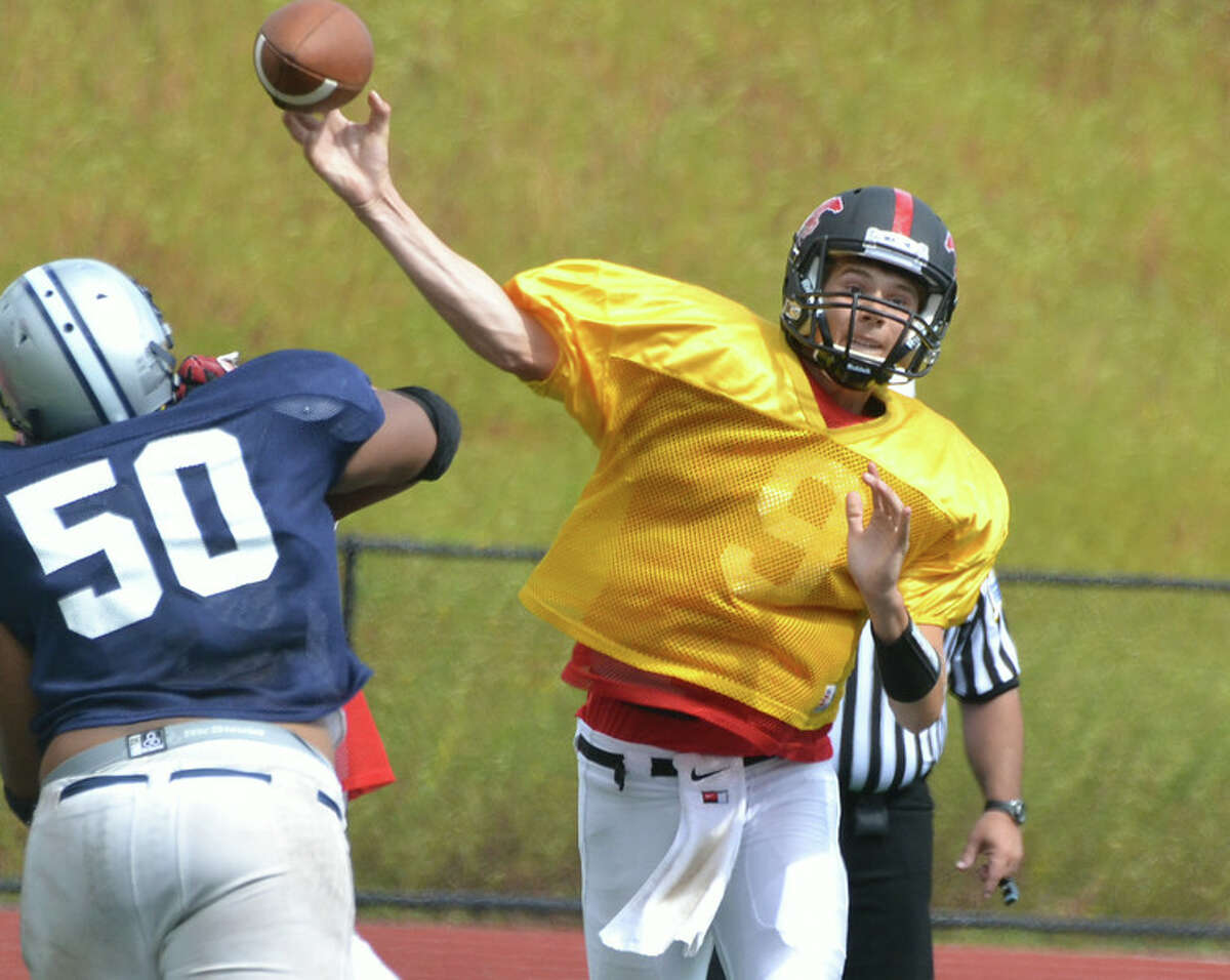 New Canaan football tops Warde for eighth victory