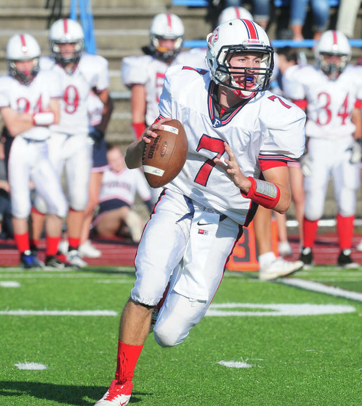 Jake Kasuba, who was one of the state’s most prolific passers (2,918 yards and 27 TDs) returns to guide the Lions in 2014. (Photo Arnold Gold – Register)