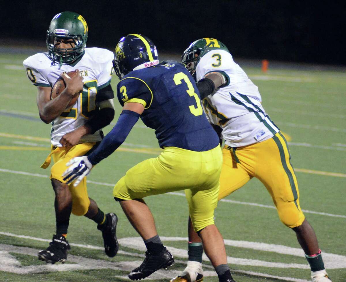 Photo by Dave Phillips. Hamden’s Maliek Williamson rushed for 121 yards and two touchdowns in the Green Dragons’ 13-7 win at East Haven on Friday night.
