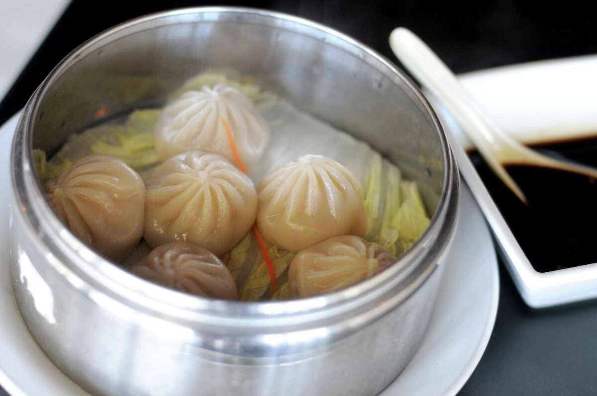 Soup dumplings are filled with chicken or a mixture of pork and crab at Dashi Sichuan Kitchen + Bar.
