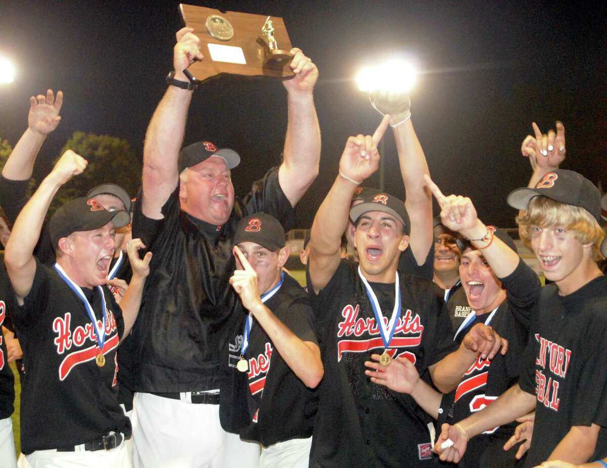Branford’s George Dummar raises the Class L State title plaque after they defeated Berlin in 2009. Photo by Dave Phillips