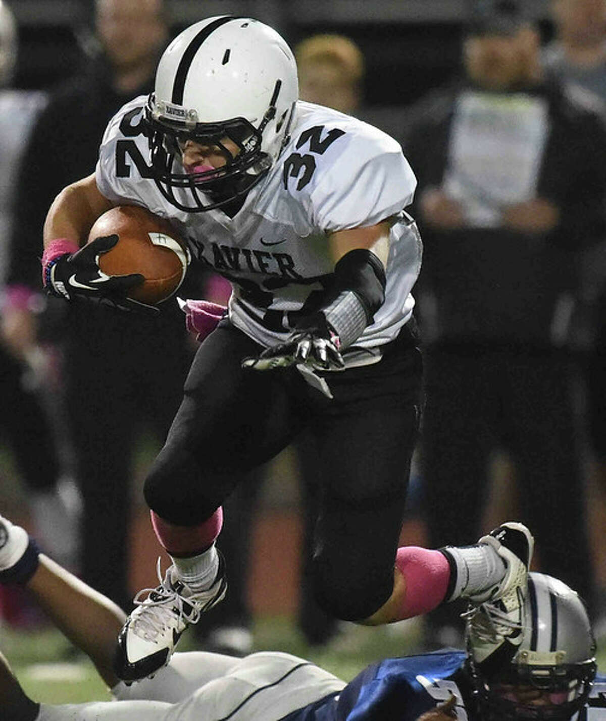 Edwin Luster runs for yardage during Xavier’s 38-6 victory over Hillhouse Friday at SCSU (Peter Hvizdak – New Haven Register)