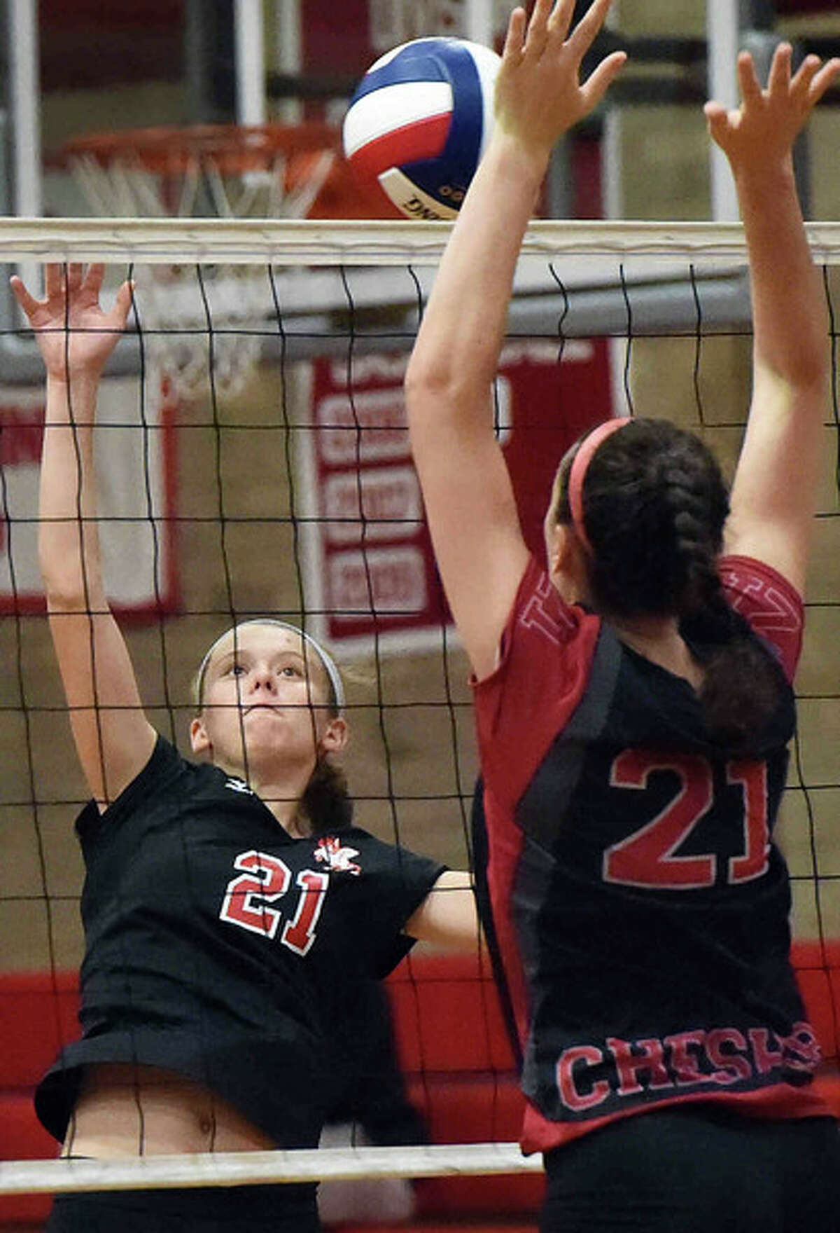 Marissa Minore of Branford H.S., left, has her shot blocked by Jill Howard of Cheshire H.S. during girls volleyball action at Cheshire High School Wednesday, October 8, 2014. (Photo Peter Hvizdak – New Haven Register)