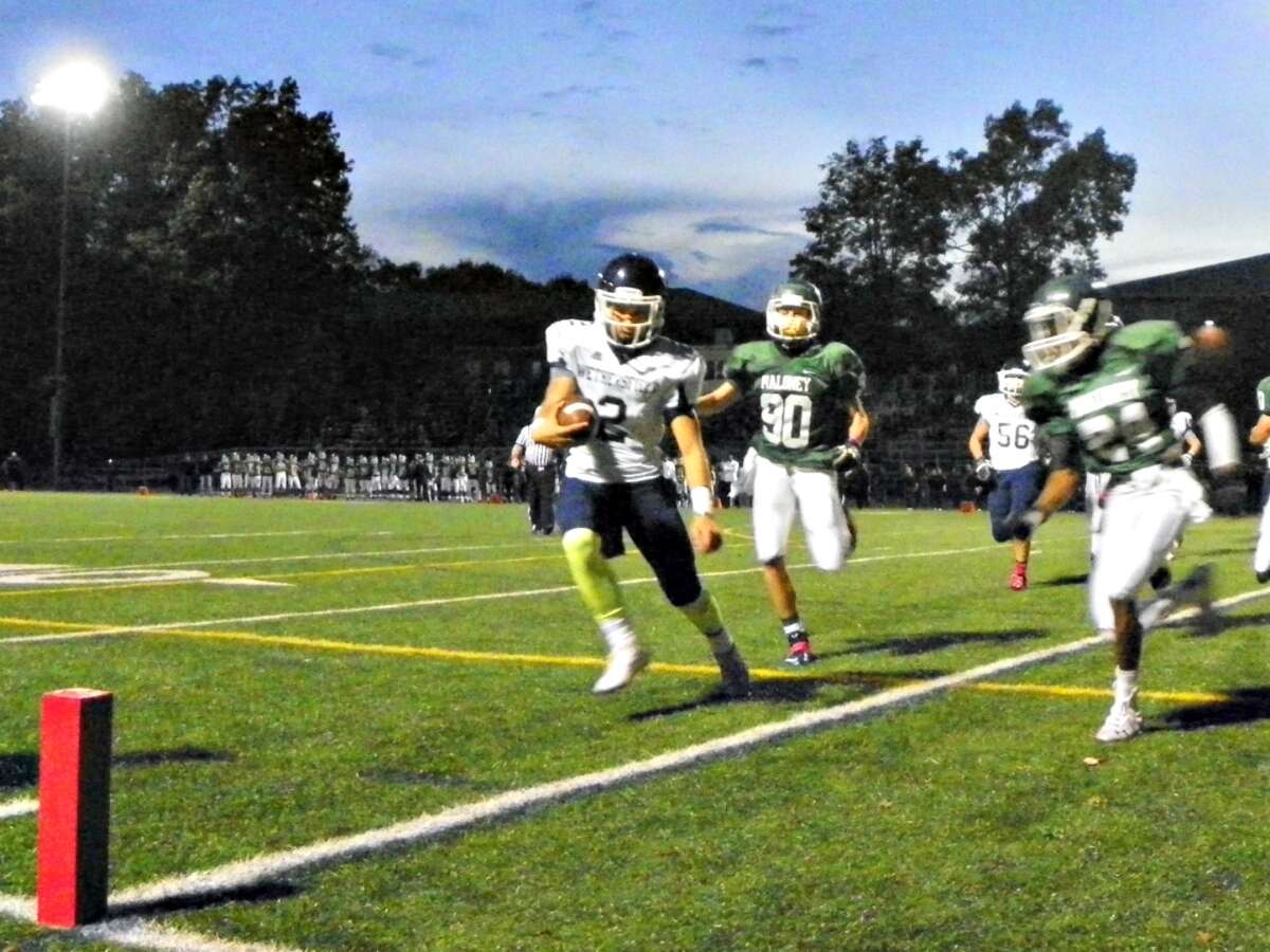 Wethersfield quarterback Matt Sanzaro rushes in from two yards in the first quarter to get the Eagles on the board. Wethersfield defeated Maloney, 41-0 on Friday at Falcon Field in Meriden. Derek Turner – GameTimeCT
