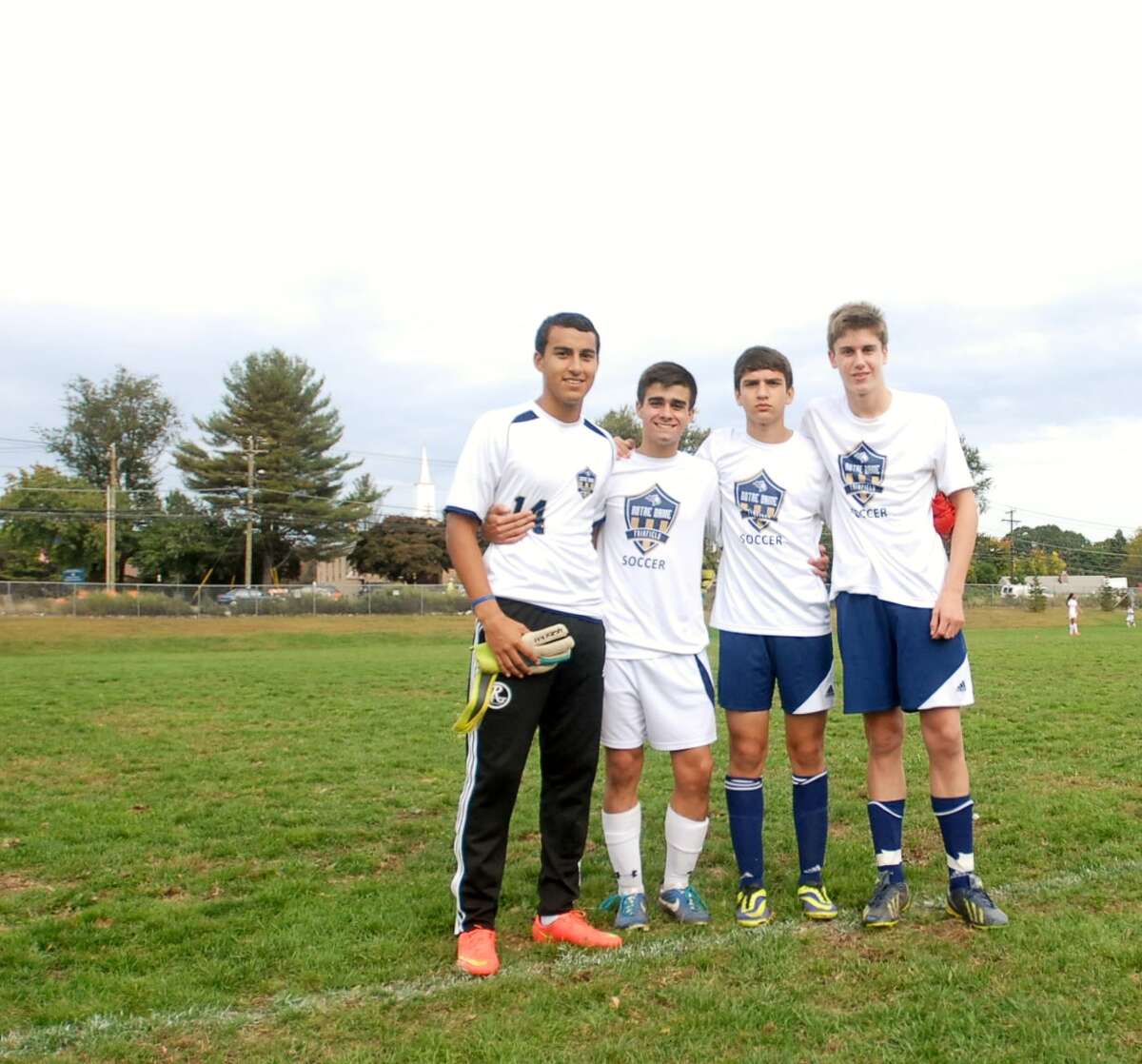 Notre Dame-Fairfield boys soccer captains pose for a picture last week. The Lancers are just a few games away from qualifying for the state tournament for the first time since 1993. Photo by Mary Albl