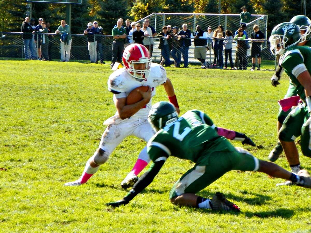 Berlin senior running back Eric Garcia makes a defender miss late in the game vs. Northwest Catholic on Saturday. The Redcoats beat the Indians 27-8 in a CCC Division III game. Derek Turner-GameTimeCT