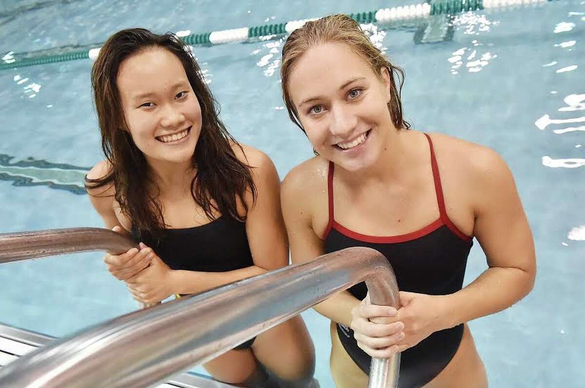 Amity’s Dana Chung, left, and Cheshire’s Lindsay Smalec at the Hamden Hall pool
