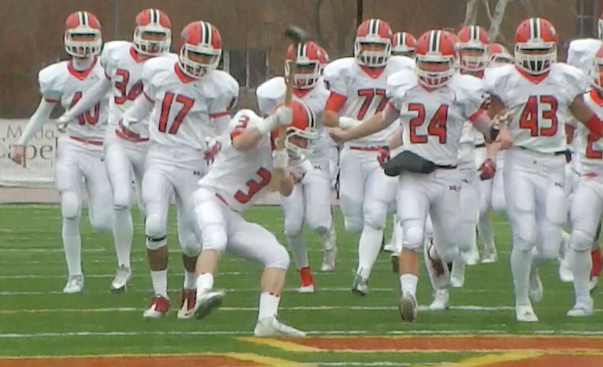Teagan Saitta drops the hammer at St. Joseph’s midfield as New Canaan ran out on the field to start its 41-14 victory over St. Joseph (Screen cap Sean Patrick Bowley)