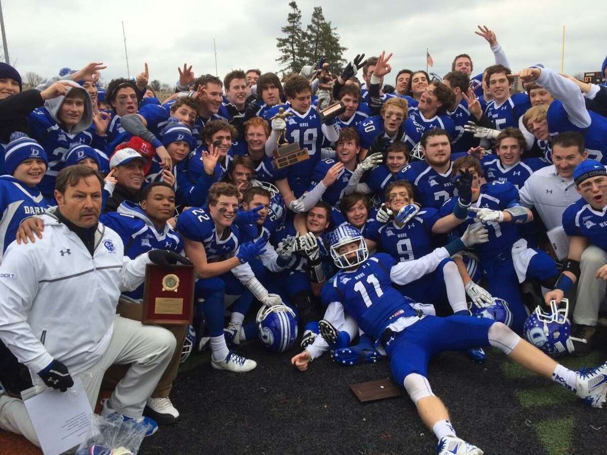 Darien celebrates its 28-21 overtime victory over New Canaan in the FCIAC Championship at Boyle Stadium in Stamford (Photo by Sean Patrick Bowley)