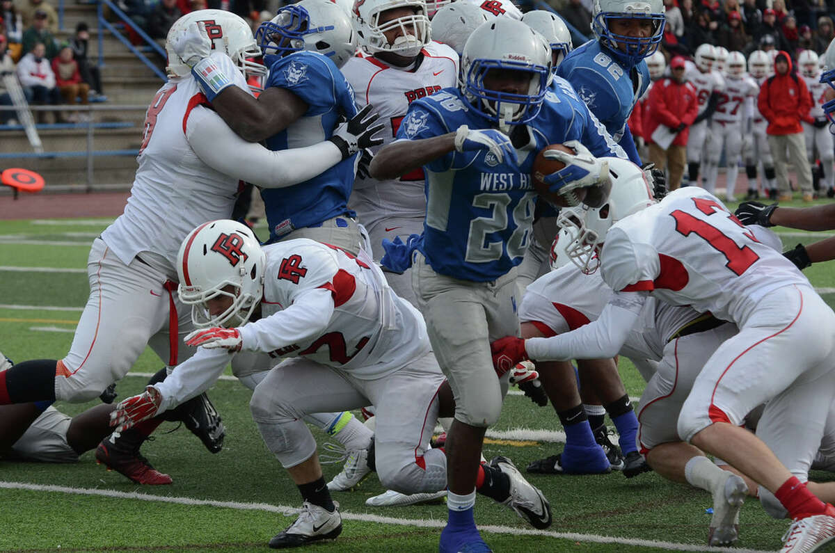 Anthony Godfrey breaks through the line during the West Haven 21-14 victory over Fairfield Prep (Photo Bill O’Brien)