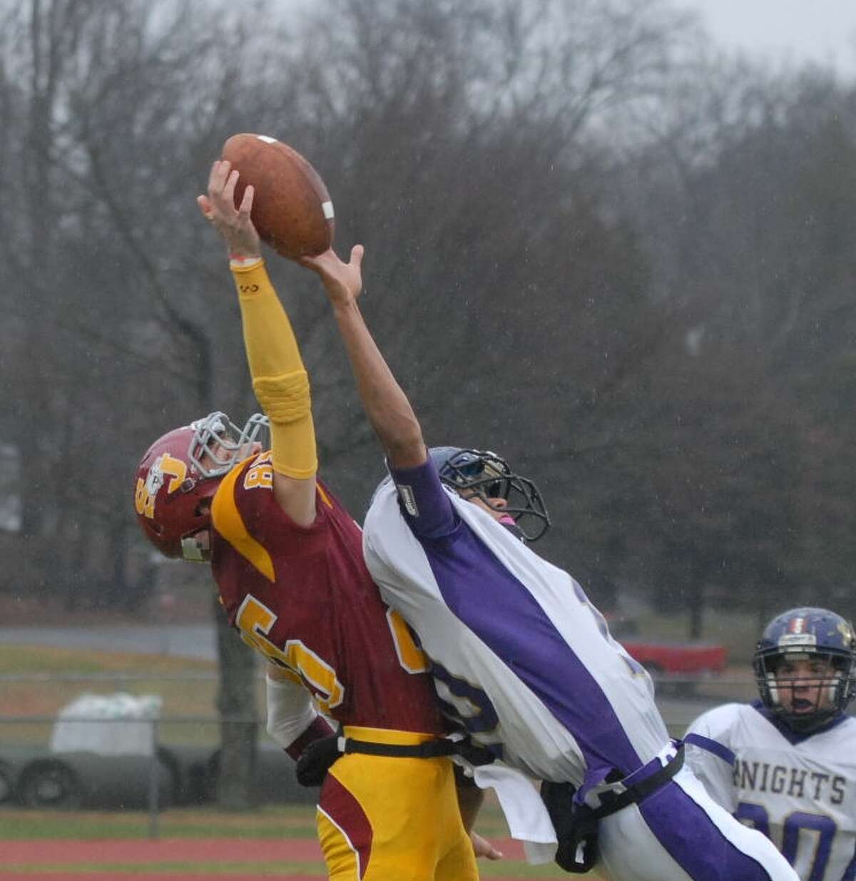 St. Joseph and Ellington/Somers battle for the ball Saturday at Trumbull. Photo by Mary Albl
