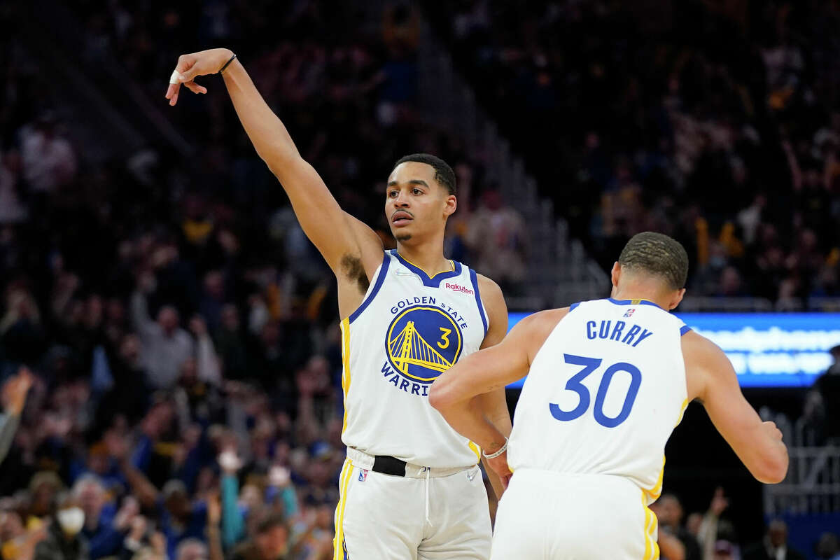 Golden State Warriors guard Jordan Poole is congratulated by Stephen Curry after scoring during Game 2 of an NBA basketball first-round playoff series against the Denver Nuggets in San Francisco, Monday, April 18, 2022. 
