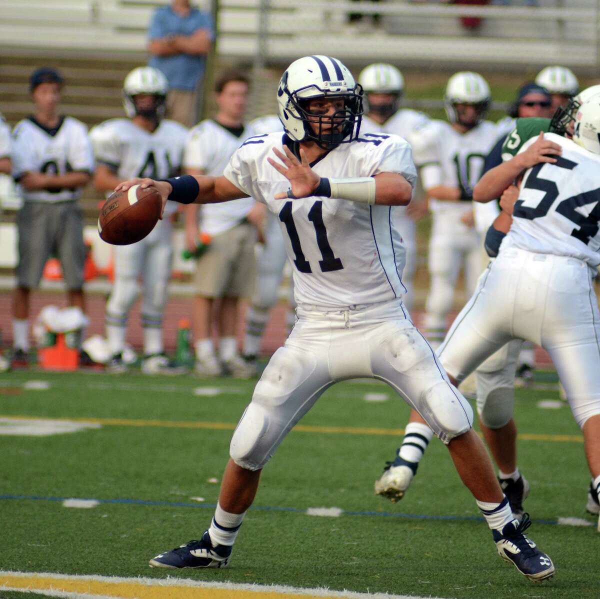 Wilton’s Brett Phillips passes during the Warriors’ 21-20 victory over Guilford. (Photo by Dave Phillips.)